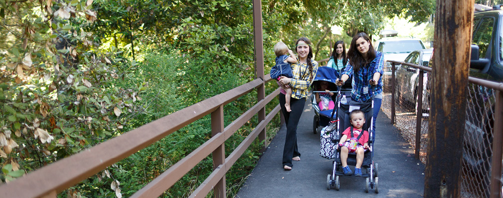 Amata Girls Pushing a Stroller